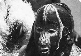 Traditional costume and mask during filming.
